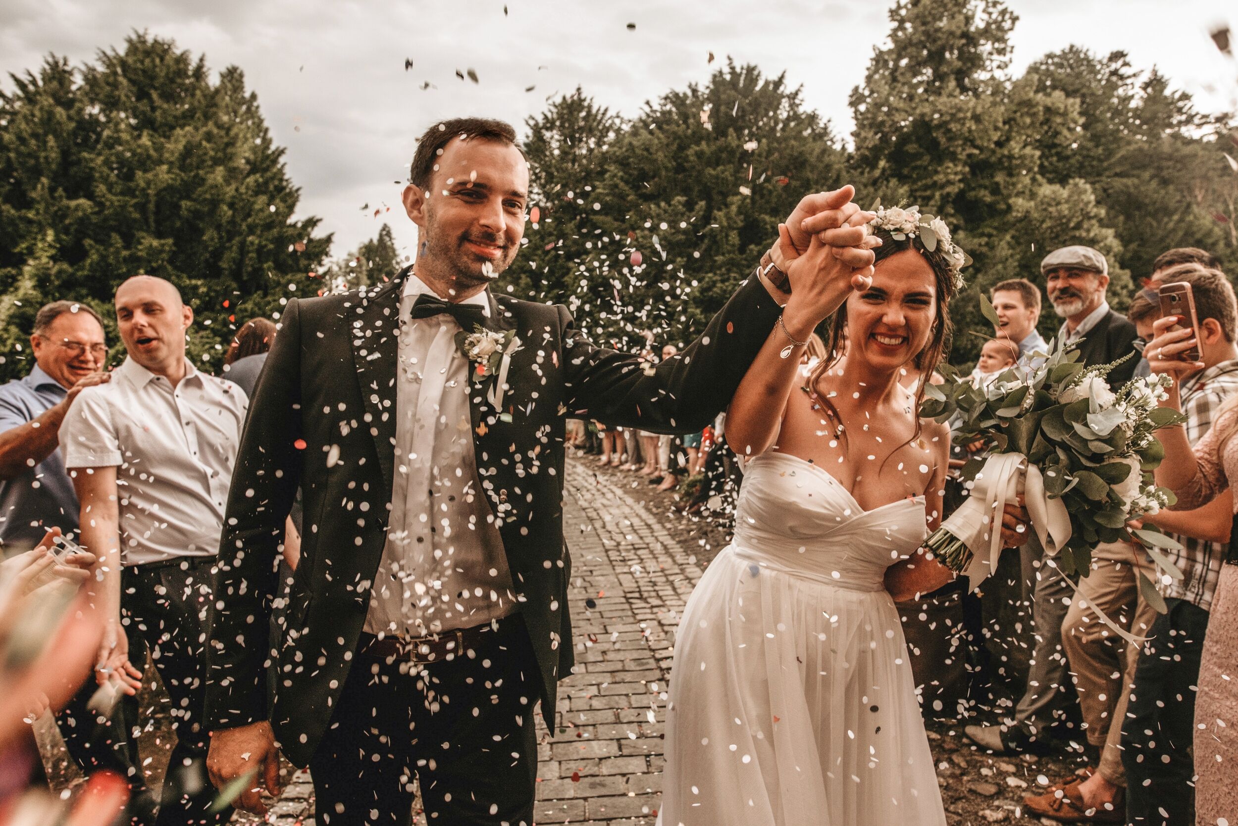 Bride and Groom celebrate wedding with outdoor ceremony