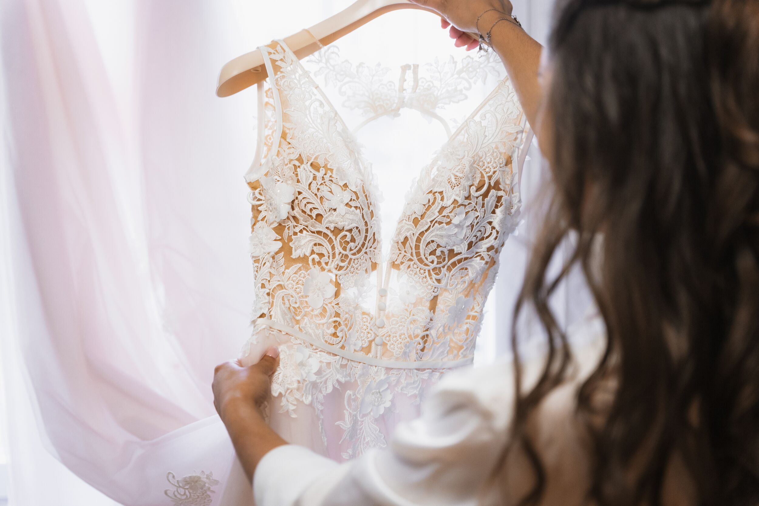 Nervous bride holding wedding dress before ceremony