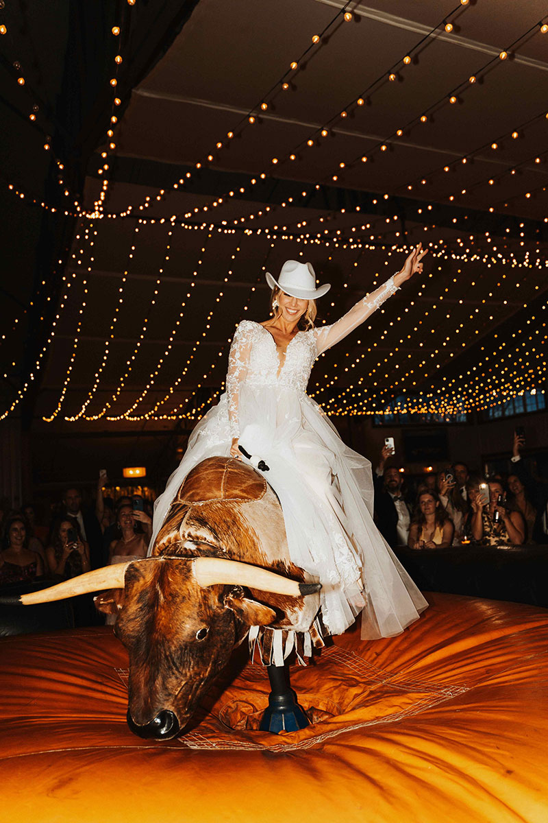 Buck Wild 17 - Sarah Penny Photography - Mechanical Bull Riding Rental Bride Wedding Vendor Buck Wild Bride on Bull - Sarah Penny Photography - Mechanical Bull Riding Rental Bride Wedding Vendor