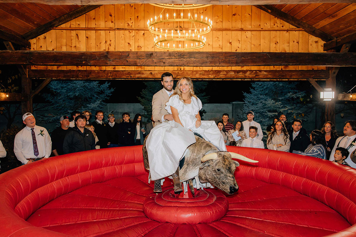 Buck Wild 8 - Jackie Siggard Photo + Video - Mechanical Bull Riding Rental Wedding Vendor Buck Wild Bride and Groom on Bull - Jackie Siggard Photo + Video - Mechanical Bull Riding Rental Wedding Vendor