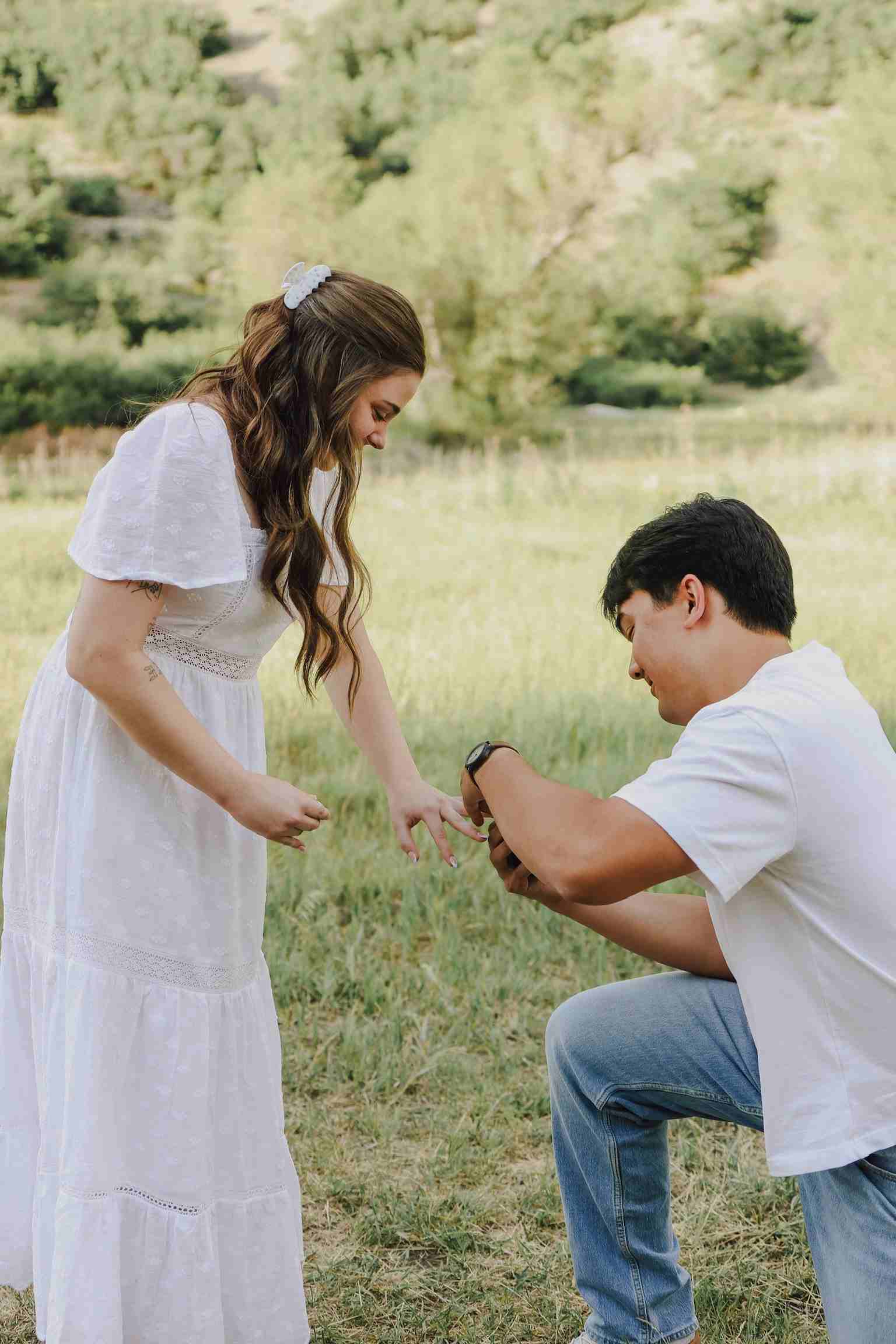 Patrick Putting Engagement Ring on Cali