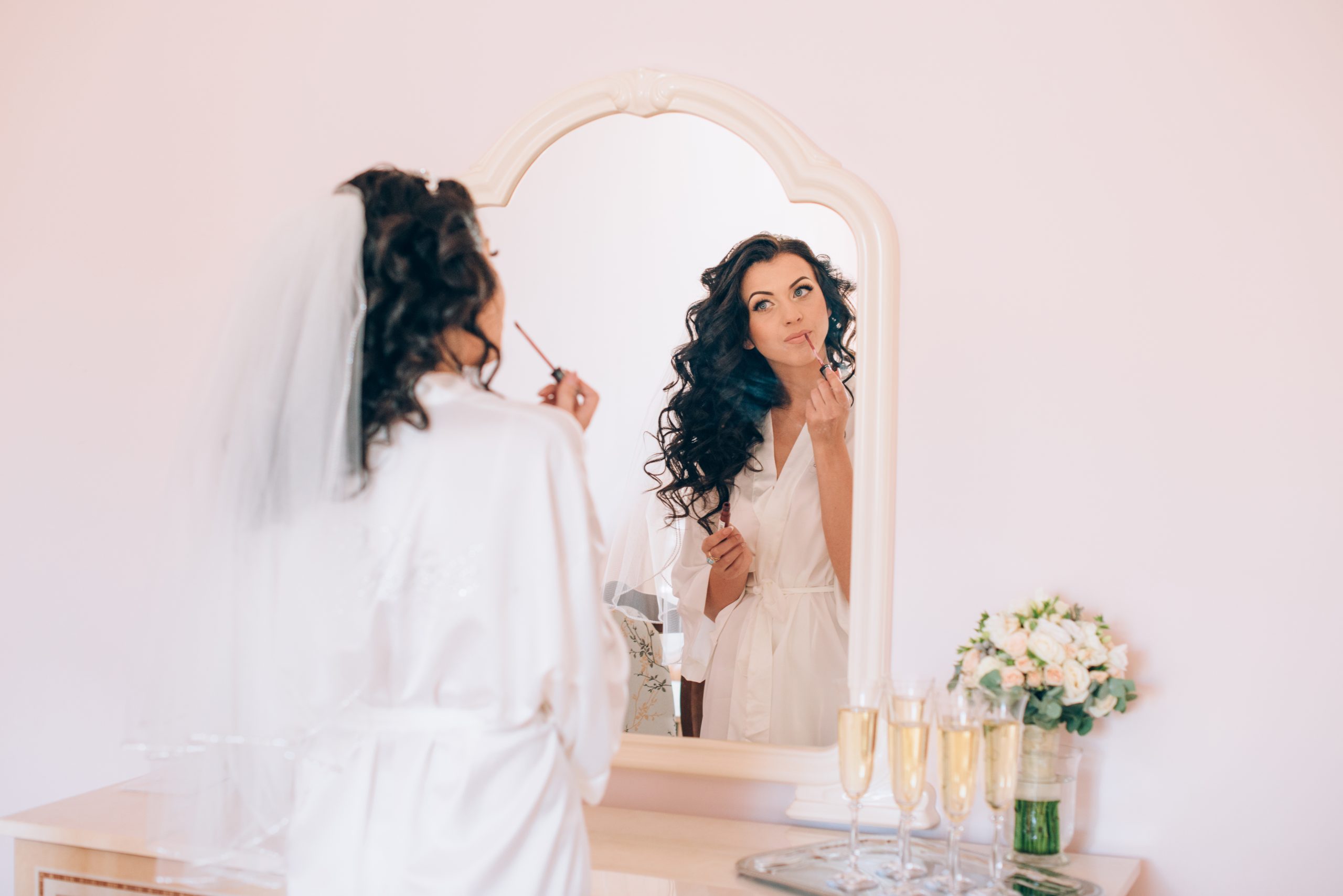 Beautiful happy bride with wedding hairstyle bright makeup in bridal day in love. Happy sexy girl waiting for groom. Romantic lady beauty model bride in bridal day have final preparation for wedding